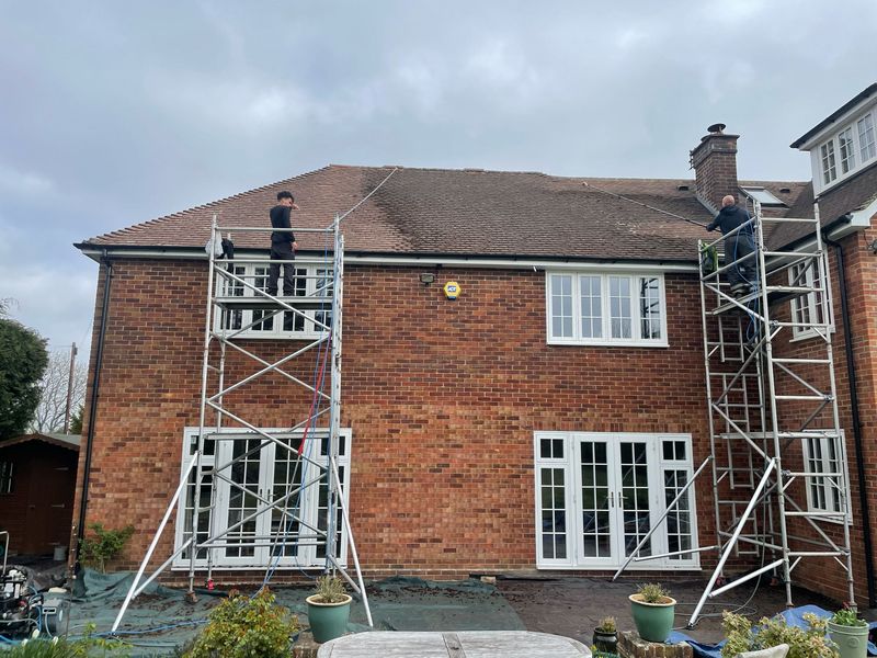 Roof cleaning carried out safely from scaffold towers by The Roof Moss Cleaners in Kenilworth